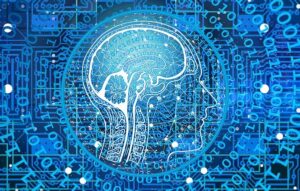 Blue cartoon image of a brain with computer language surrounding it