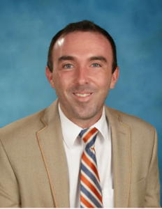 Headshot of man in suit