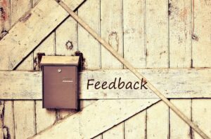 Feedback, brown box on a wooden door