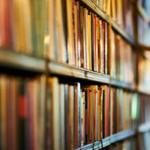 A close-up of a bookshelf filled with colorful books.