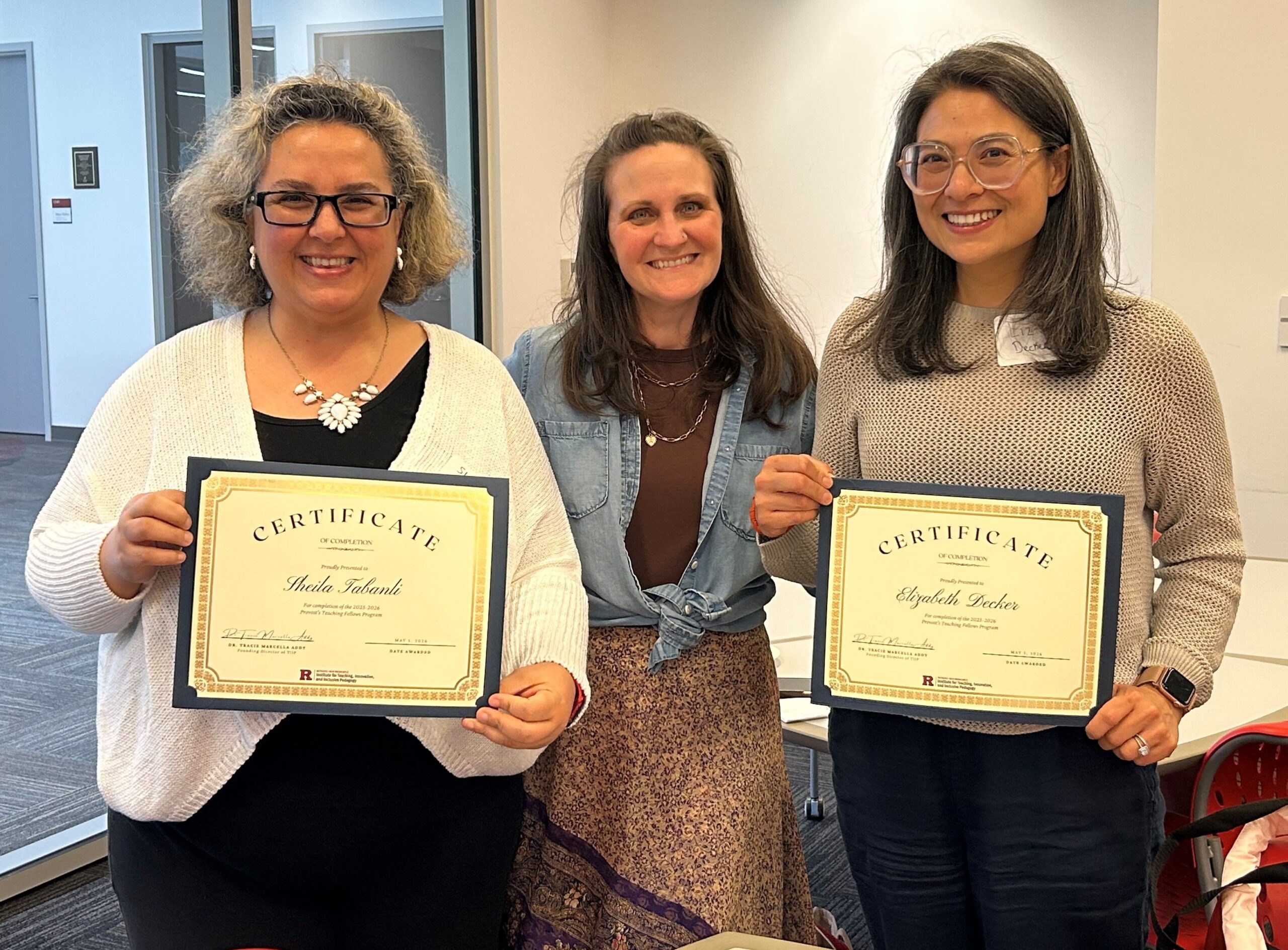 Three participants pose with certificates recognizing completion of the 2025–2026 Provost’s Teaching Fellows Program at Rutgers–New Brunswick.
